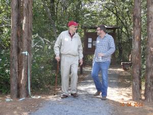 HWT board members Dick Udouj and Dustin Collyge walking the trail